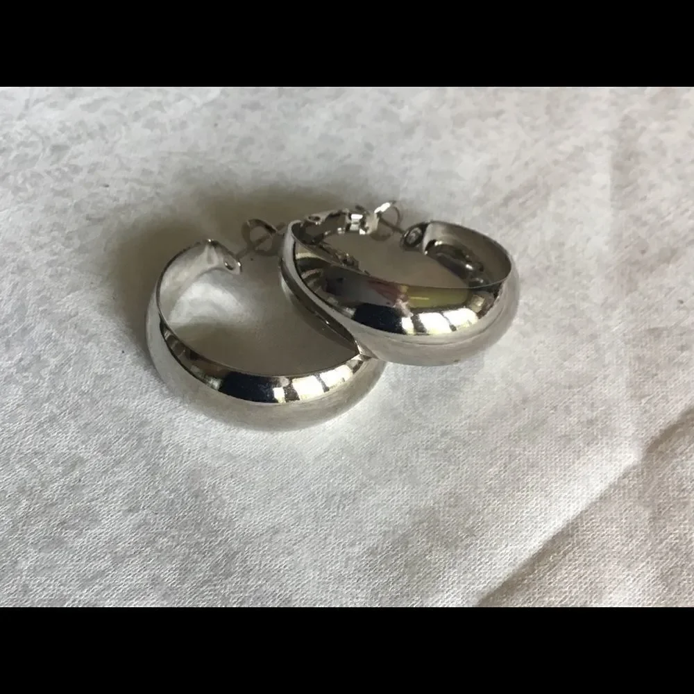 $8 ea or 3/$15. Silvertone  Shiny Hoop Earrings.